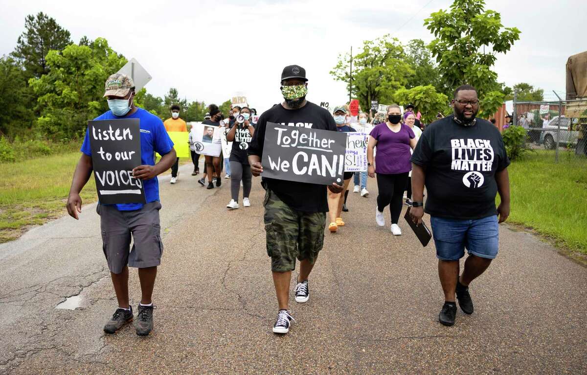 Demonstrators take lead of a peace march in solidarity with George Floyd in Willis, Wednesday, June 3, 2020. Approximately 130 people attended the rally.