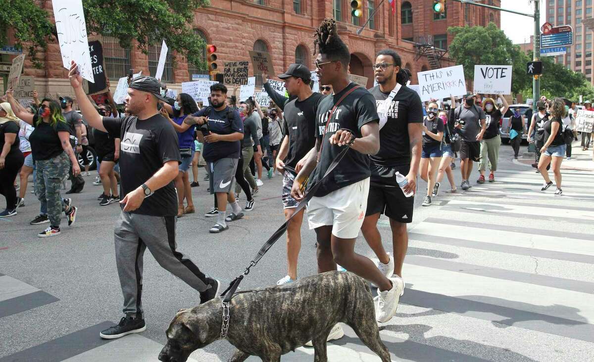 Spurs players Lonie Walker and Bryn Forbes participate in a march to the county courthouse after demonstrators gather at the police headquarters in San Antonio to show their sentiments concerning the George Floyd death on June 3, 2020.