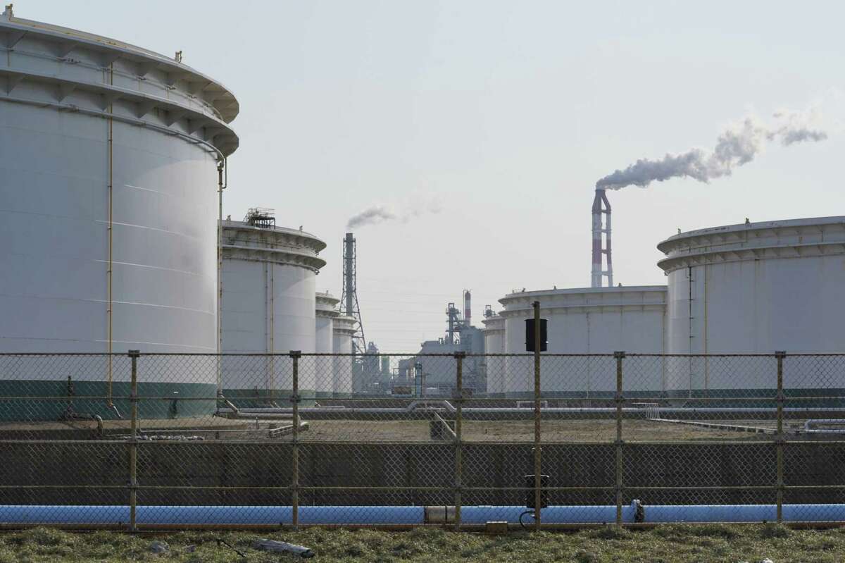 Oil storage tanks operated by Kashima Oil Co., stand in Kamisu, Japan, on April 29, 2020.