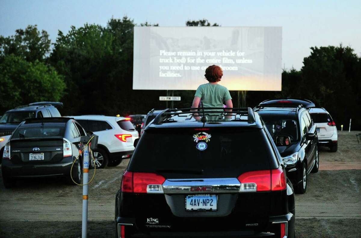Patrons enjoy movies offered on three screens at Mansfield Drive-In Movie Theater in Mansfield, Conn., on May 26.