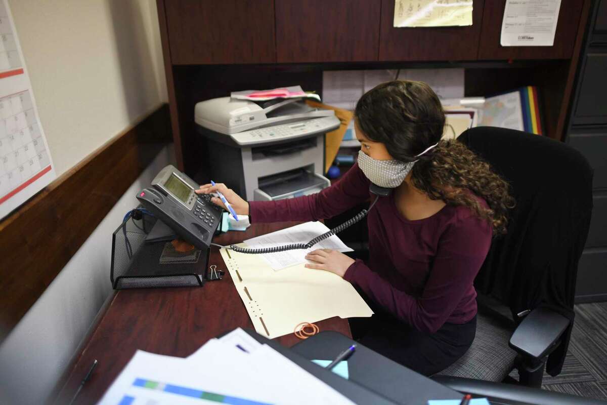 Andrea Valadez, who is almost done with a master’s degree in public health from UT Health San Antonio, has been volunteering as a contract tracer for San Antonio Metro Health. She works the phones on Thursday, May 7, 2020.