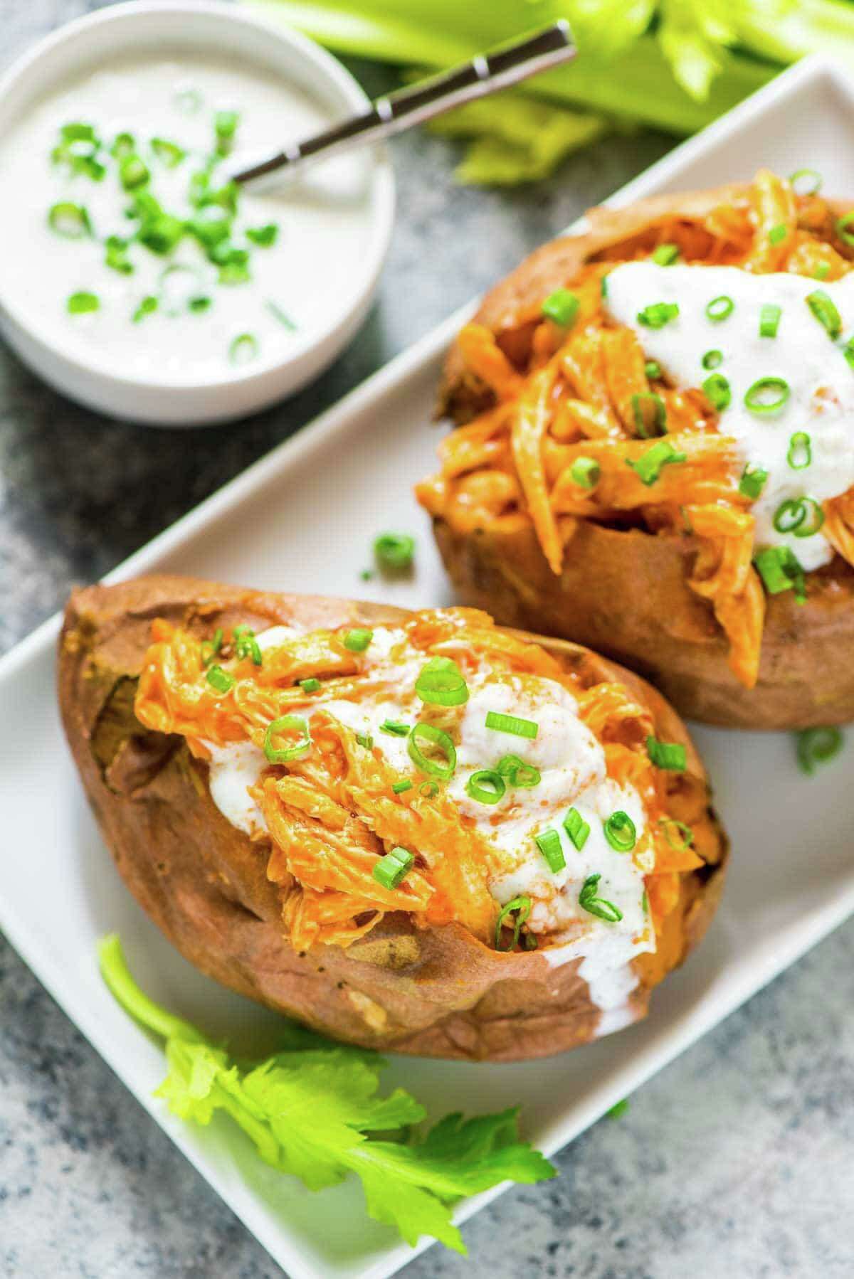 Buffalo Chicken Sweet Potatoes, by Erin Clarke, author of “The Well Plated Cookbook” and creator of the healthful recipe blog Well Plated by Erin, wellplated.com.