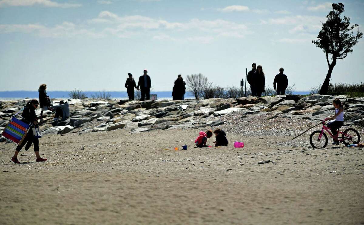 Visitors take advantage of the nice weather Wednesday, April 1, 2020, at Sherwood Island State Park in Westport, Conn.