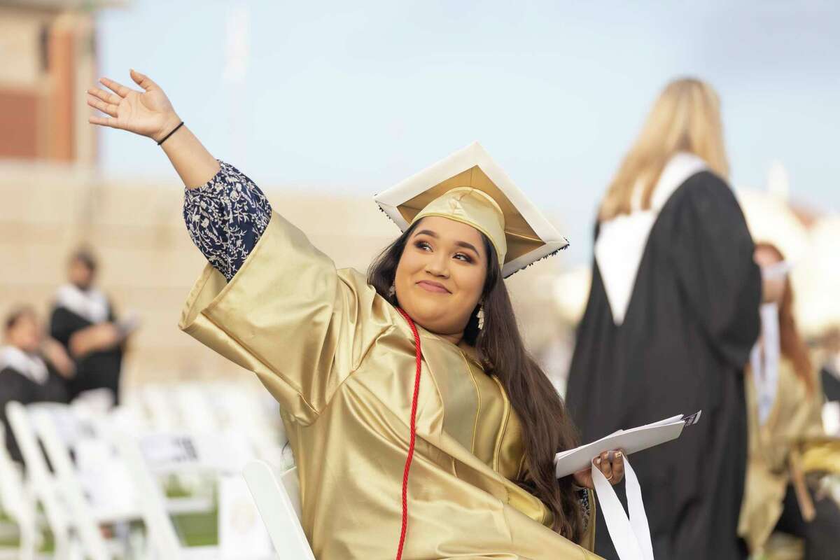 Veronica Guadalupe Hernandez waves at her family during a Conroe High School graduation ceremony at Woodforest Bank Stadium in Shenandoah, Thursday, June 4, 2020. Graduates and families were asked to practice social distancing to prevent any spread of the COVID-19 virus.