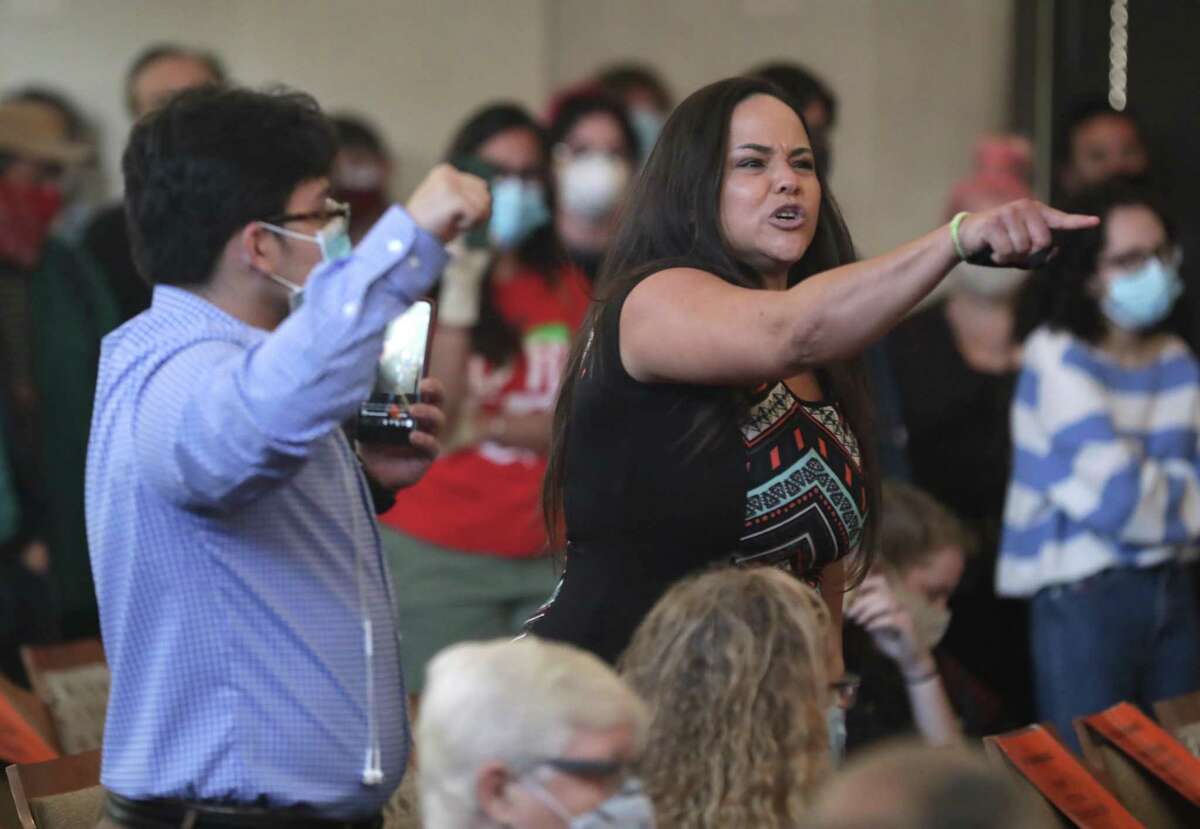 Jolene Garcia, right, yells at city council members concerning the police funding, on Thursday , June 4, 2020.