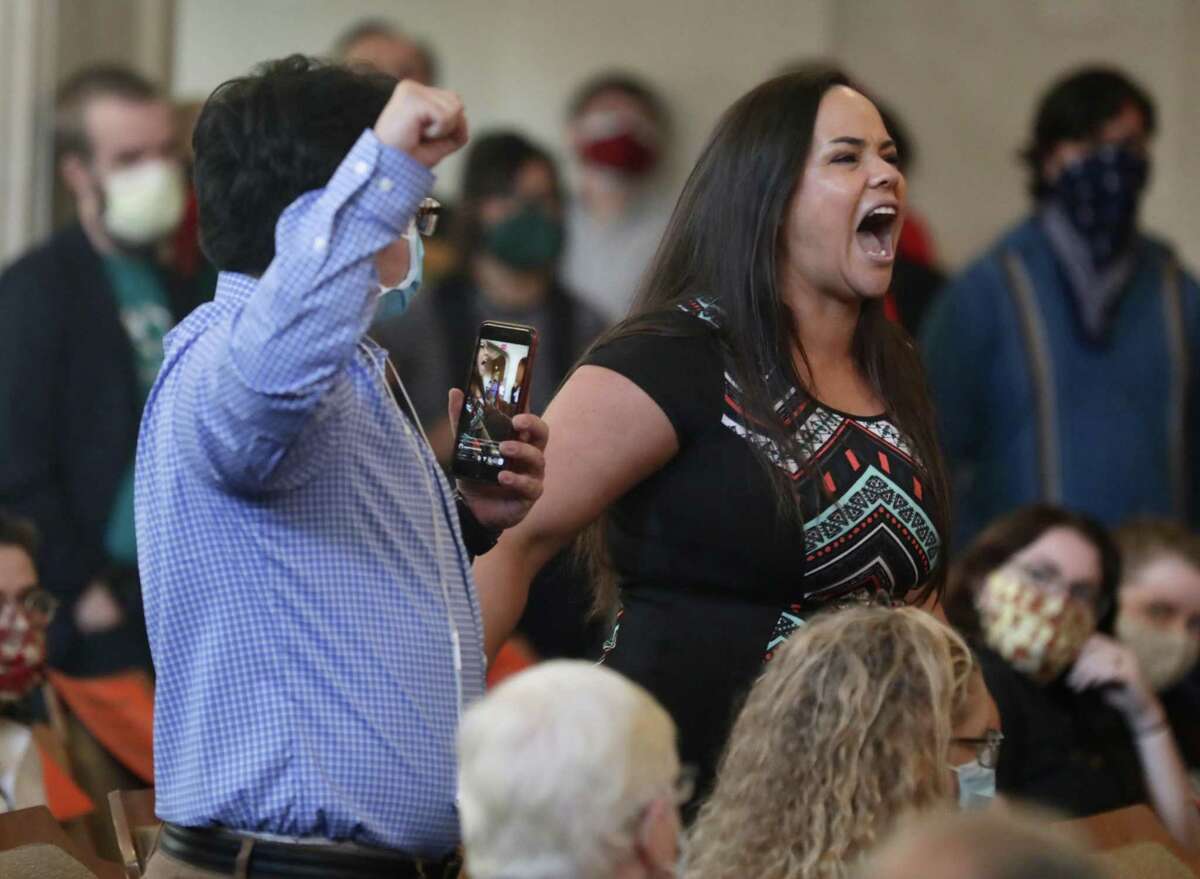 An angry Jolene Garcia, right, yells at San Antonio City Council members during a council meeting Thursday, June 4, 2020. Garcia was among the demonstrators who have taken to San Antonio streets to seek justice for George Floyd, who died in the custody of a Minneapolis police officer who has been charged with murder in his death. She and others want the council to cut funding to the police department.
