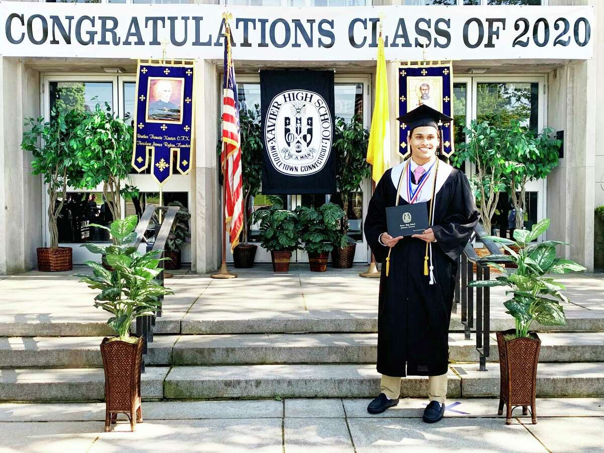 Xavier High School held its graduation ceremonies virtually May 22 to 24. Shown here is Shreyas Vasireddy, who had just received his diploma in Middletown.