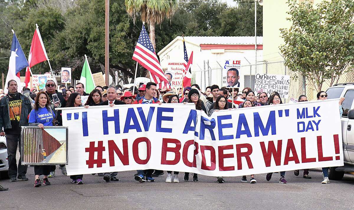 Marchers took to the streets of downtown Laredo for the Martin Luther King Day “I Have a Dream” #No Border Wall rally this year. A border wall would destroy the fabric of downtown Laredo and, plus, it’s ineffective.