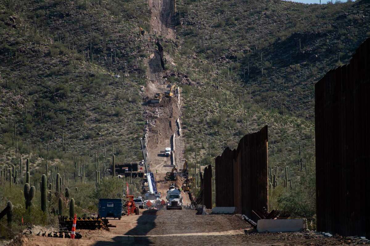 The border fence construction continues up a mountain in the Organ Pipe Cactus National Monument in Lukeville, Arizona, in January.