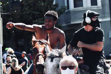 SF protest in the Mission District had an uplifting sight — two horses