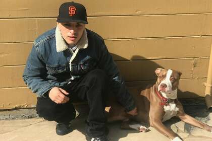 Sean Monterrosa with the family dog, Gucci. Monterrosa was fatally shot by Vallejo police on Tuesday as he was kneeling outside a Walgreens and not carrying a firearm when an officer opened fire.