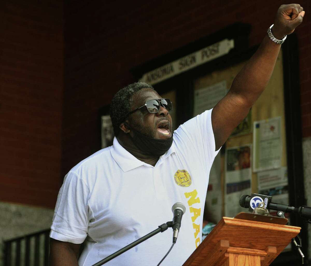 A chant of "Black Lives Matter" is lead by Valley NAACP head Greg Johnson during a gathering of local ministers, political leaders and residents outside City Hall on Main Street in Ansonia, Conn. on Thursday, June 4, 2020.