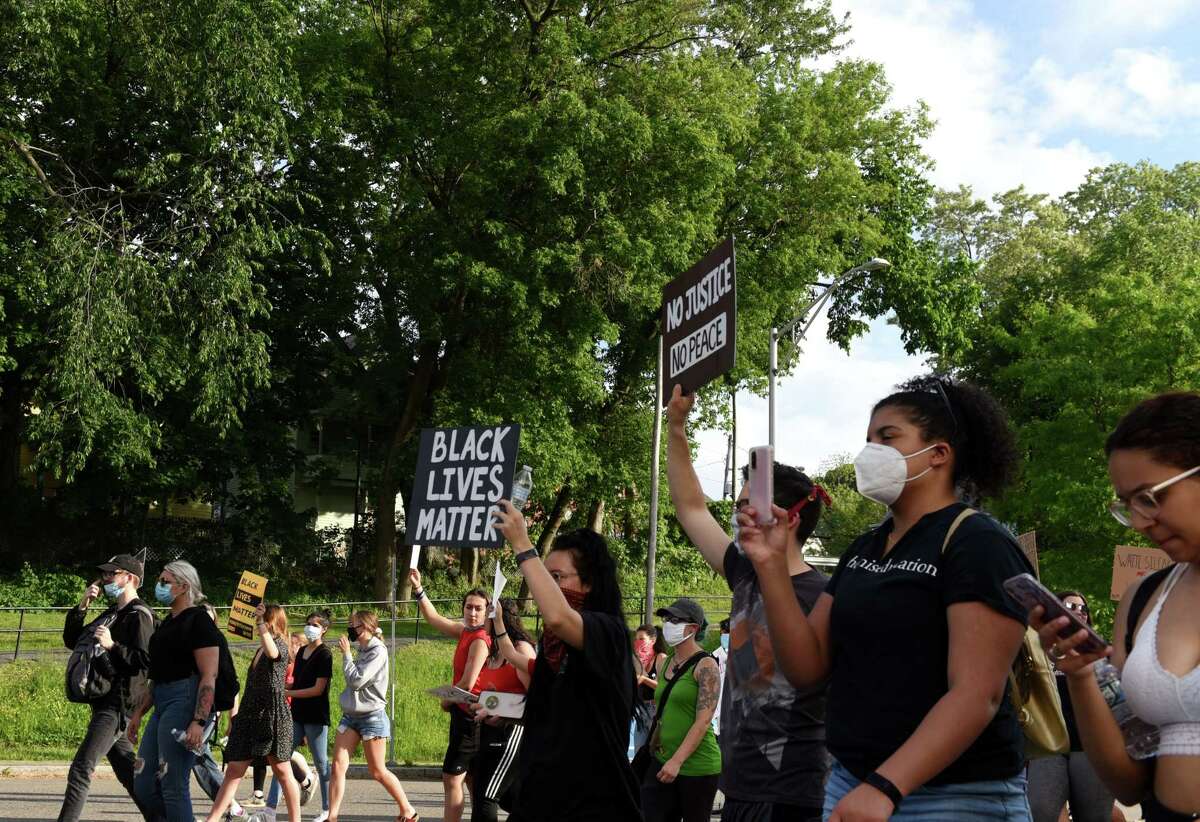 Black Lives Matter demonstrators march up Veeder Avenue during a rally to end to police brutality and systemic racism on Thursday, June 4, 2020, in Schenectady, N.Y. The event included speeches held outside Schenectady County Jail before marching through city streets. (Will Waldron/Times Union)