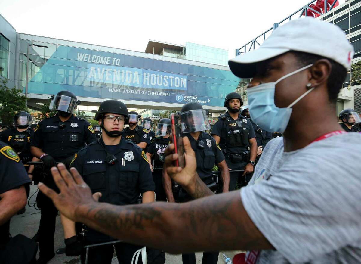 Demonstrators meet police June 2, 2020, in downtown Houston during the fifth night of protests across the nation sparked by the death of former Houston resident George Floyd.