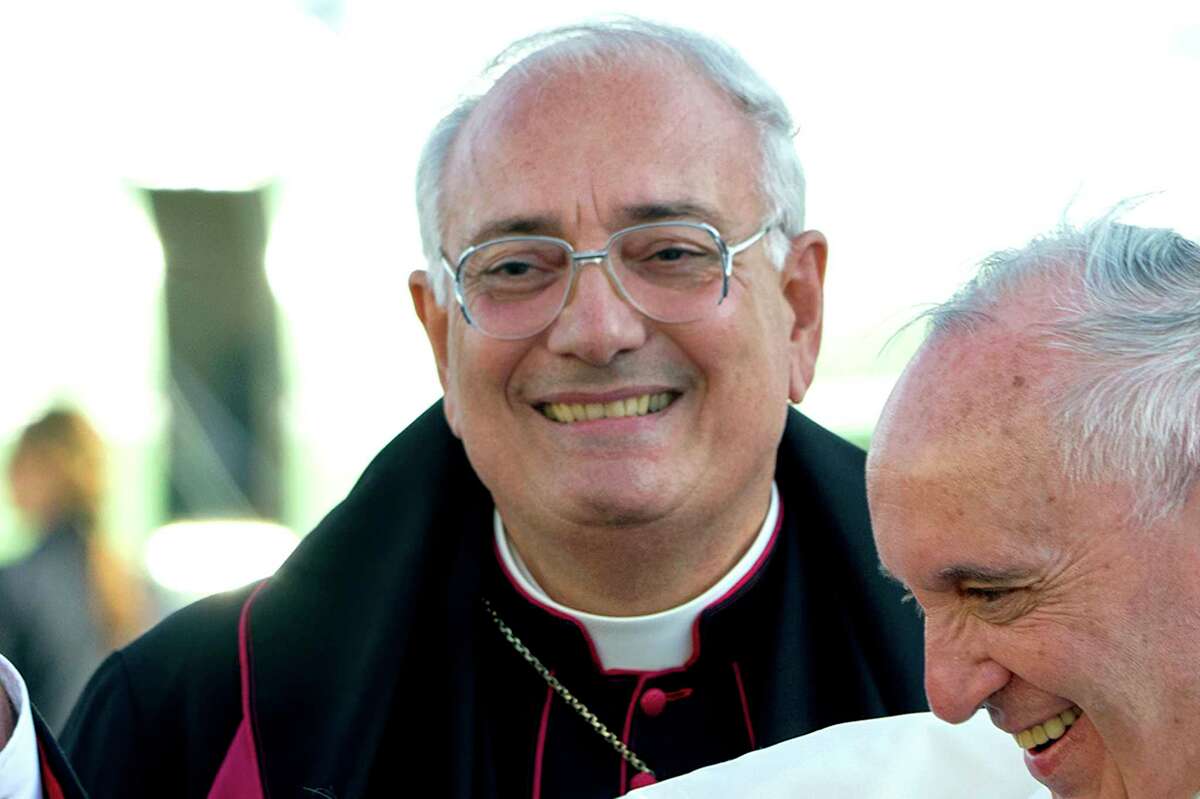 FILE - This Thursday, Sept. 24, 2015, file photo shows Brooklyn Bishop Nicholas DiMarzio as Pope Francis, right, arrives at John F. Kennedy International Airport in New York. DiMarzio, already under a church investigation for alleged sex abuse, has been accused by a second man who says he was molested in the 1970s. (AP Photo/Craig Ruttle, Pool)