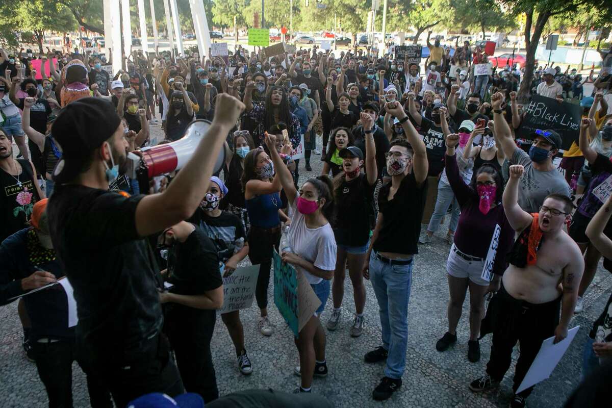 Protestors are lead in a chant outside Public Safety Headquarters in downtown San Antonio, Texas, on June 4, 2020. This is the sixth day of protests in San Antonio in spurred by the killing of a black man, George Floyd, in Minneapolis, on May 25, by officers following a report of Floyd using a counterfeit bill to make a purchase.