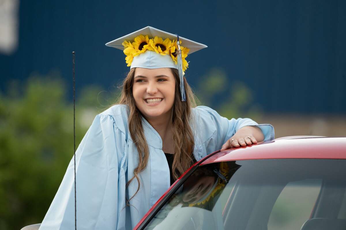 The Meridian Early College High School Class of 2020 celebrate their graduation during a drive-through diploma ceremony Thursday, June 4, 2020 at the school. (Adam Ferman/for the Daily News)