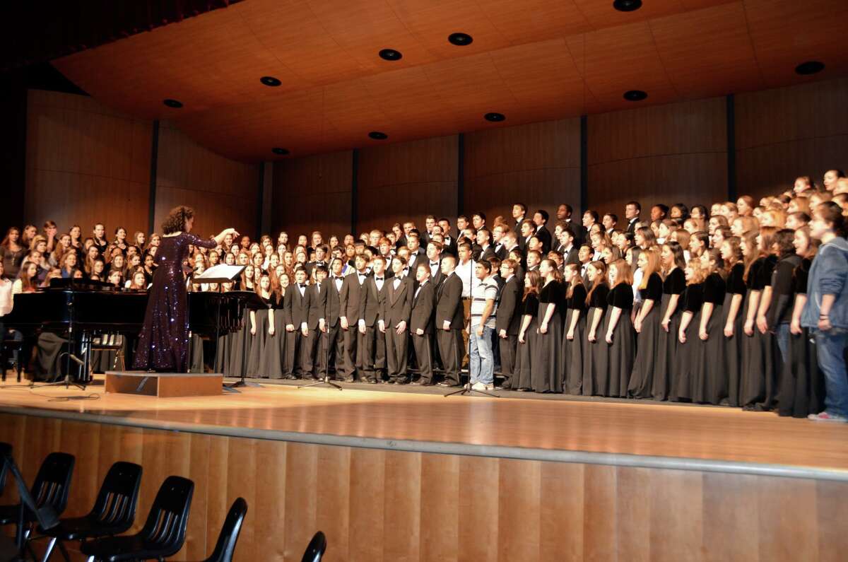 The Trumbull High School Concert Choir, under the direction of Anne Tornillo, performs a concert at the school. Tornillo recently announced her retirement.