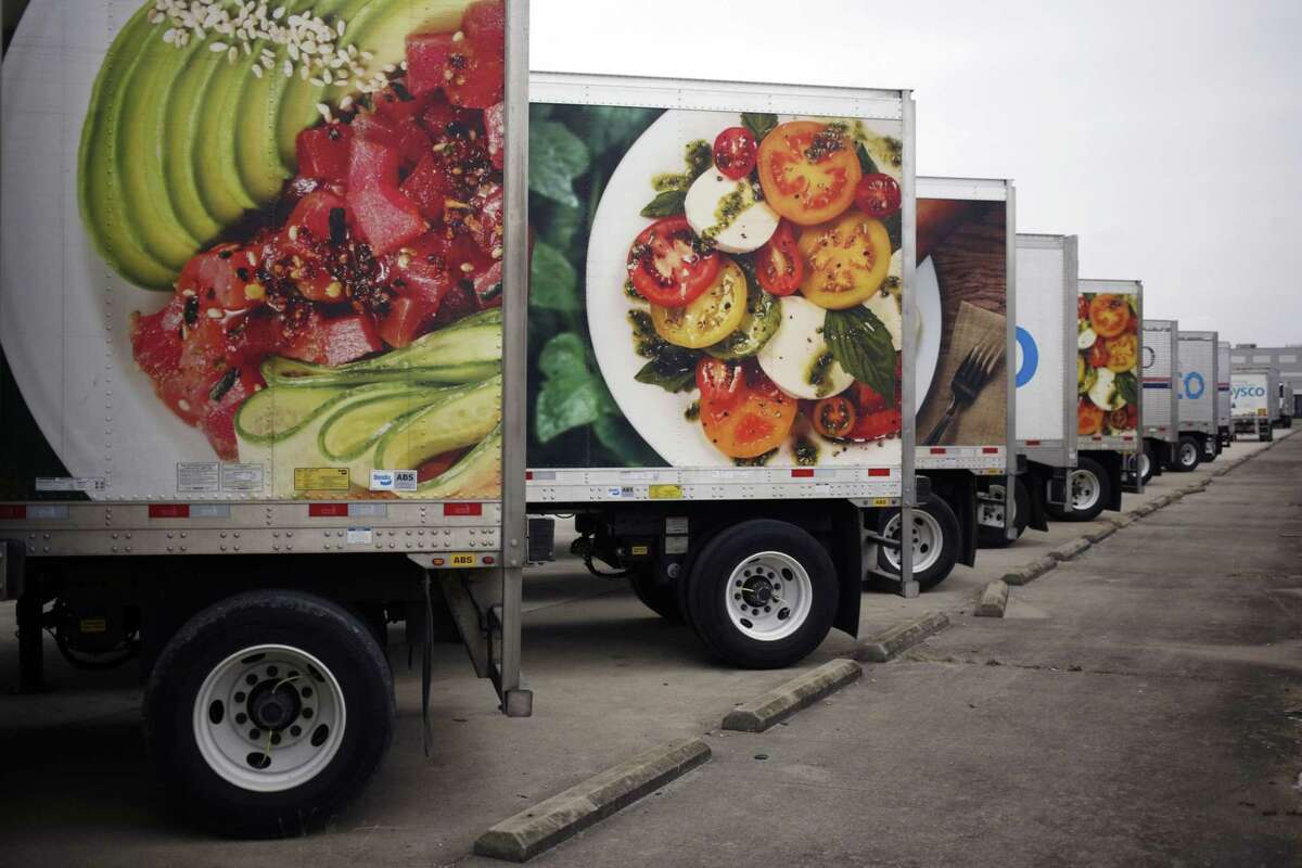 Sysco Corp. delivery trucks sit parked outside the company's distribution center in Louisville, Ky., on Jan. 29, 2020.
