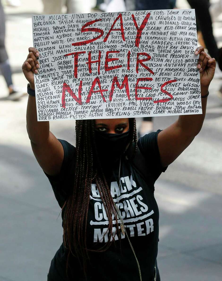 People join George Floyd’s family in Houston’s march from Discovery Green to City Hall in downtown Houston Tuesday.