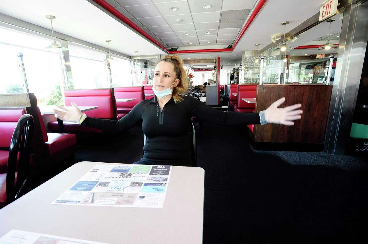 Lushe Gjuarj, owner of Lushe's Parkway Diner, is photographed on May 21, 2020 at her restaurant in Stamford, Connecticut. Gjuarj is hoping that as businesses in the state begin to reopen in Phase 1, that in the next several months with Phase II and III, that she will see a packed restaurant full of customers. She fled Kosovo as a teen during the war, bought and started the diner and during the coronavirus, she has felt the support of customers, who have made donations to help her stay open and set up the diner for outdoor dining. The diner has always provided Take Out service to the community, even in the height of the COVID-19 Pandemic.