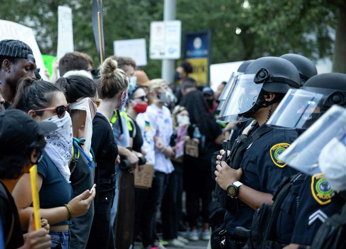 Houston Police deployed helmets and face shields during the massive June 3 downtown protest over the death of George Floyd. City council on Wednesday agreed to buy new helmets and shields.