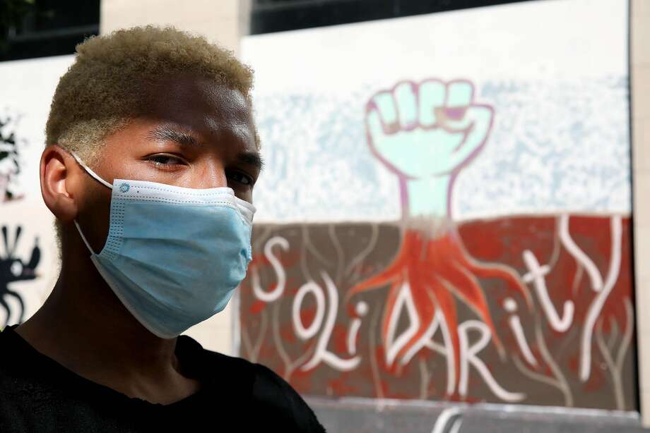 Delvin Hodges, 24, poses for a portrait near 14th and Broadway during a protest at Frank Ogawa Plaza in Oakland, Calif., on Thursday, June 4, 2020. Hodges, who is originally from Memphis, TN, but currently lives in San Francisco, attended the event to honor the late George Floyd, a 46-year-old Black man who was killed by a Minneapolis police officer last week. "I just want to walk down the street one day and not have ugly looks," Hodges said. "When that day will come, I don't know. But we're protesting now to be a catalyst for this generation and the future generation to make that change." Photo: Yalonda M. James / The Chronicle