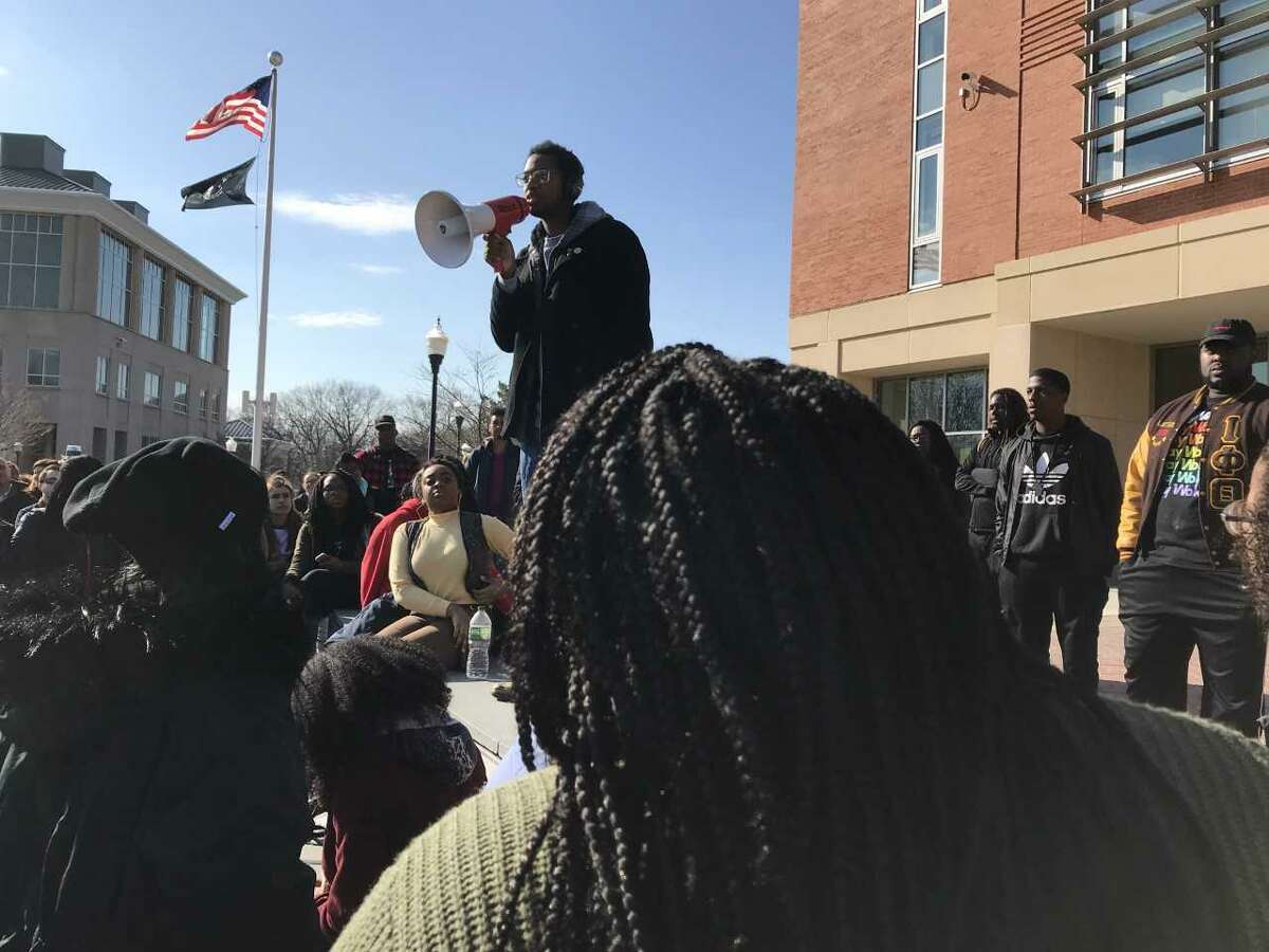 Justin Farmer, a Hamden city councilman and a student at Southern Connecticut State University, addresses a rallying crowd a week after a white faculty member used a racial slur.