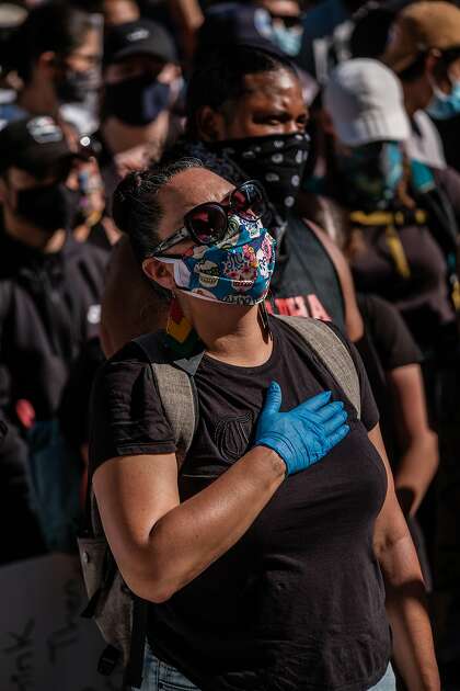 A protester wears gloves and a mask, but not all at the demonstrations did.