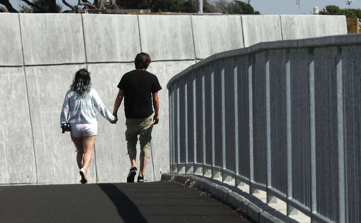 A couple hikes the new extension of the San Francisco Bay Trail seen on Tuesday, June 2, 2020, in Albany, Calif.