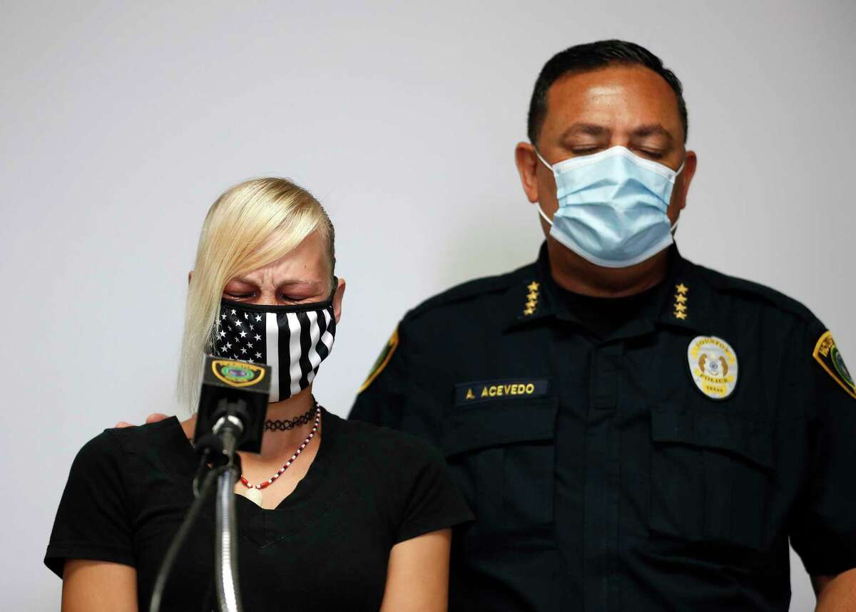 Houston Police Chief Art Acevedo stands with Jessica Chavez, whose husband, Nicolas Chavez, who was shot and killed by police April 21, 2020, in the 800 block of Gazin, during a press conference, as they were joined by the family members of other loved ones involved in recent officer-involved shooting incidents at HPD's Edward A. Thomas Building, Saturday, June 6, 2020, in Houston.