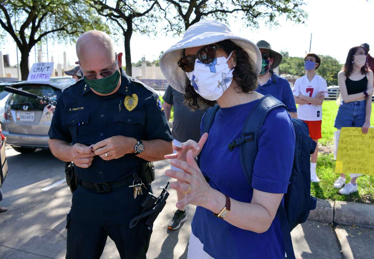 Protest organizer Claudia Stokes talks with Alamo Heights Police Chief Rick Pruitt prior to a Black Lives Matters march through Alamo Heights Saturday morning.
