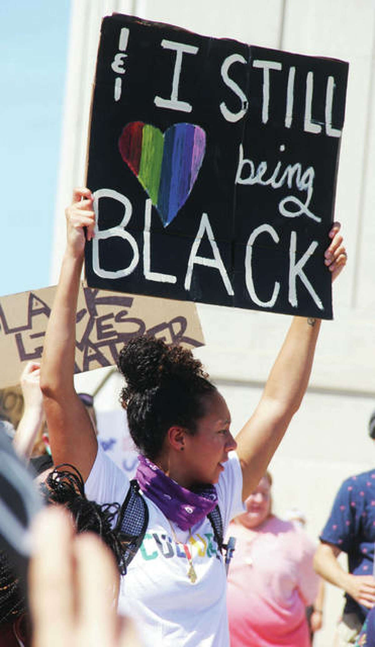 Destiny Bramblett, the assistant woman’s basketball coach at Southern Illinois University Edwardsville, carries a sign during a Black Lives Matter rally/protest Saturday morning in the plaza between the Madison County Courthouse and Administration Building. By 10:30 a.m. about 500 people had shown up for the event, the second held at the plaza.