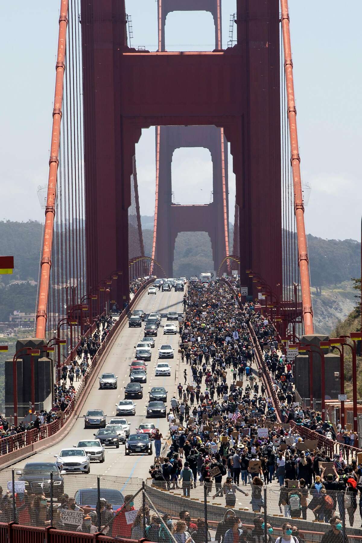 Thousands of demonstrators make their way across the Golden Gate Bridge in San Francisco, Calif. Saturday, June 6, 2020 during a march in support of the Black Lives Matter movement.