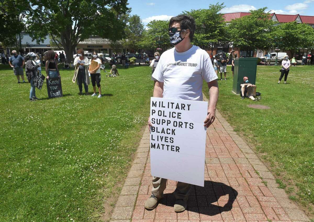 Veteran Rob Salisbury of Branford (center) participates in a Black Lives Matter protest on the Branford Green on June 7, 2020.