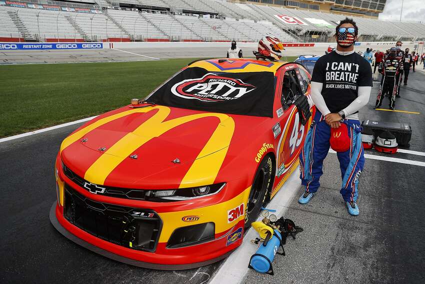 Bubba Wallace, driver of the #43 McDonald's Chevrolet, wears a 
