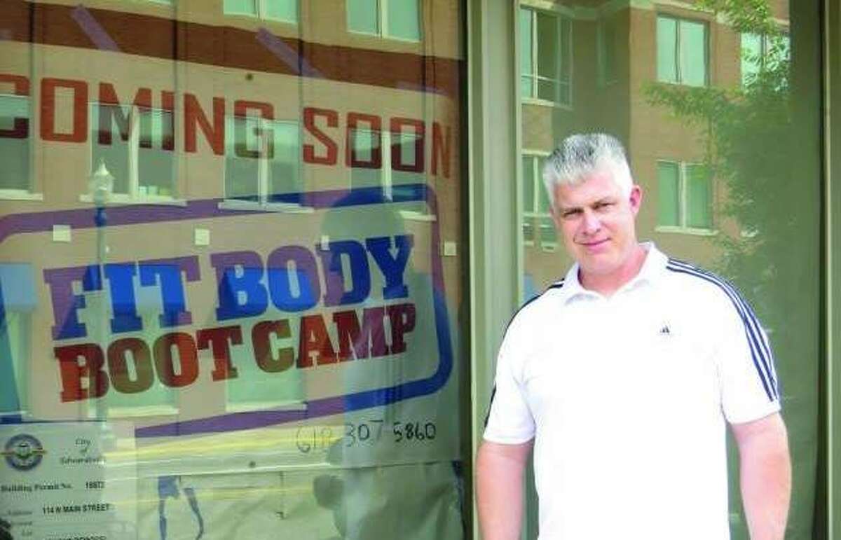 Coach Travis Akin outside of Fit Body Boot Camp in 2017 when the gym opened.