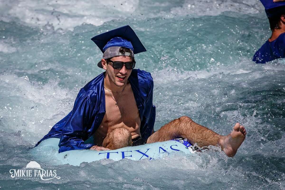 New Braunfels photographer Mikie Farias organized a photo shoot on the Comal River chute on June 6 for new graduates. The teens from New Braunfels High School showed up wearing their caps and gowns over their swimsuits.