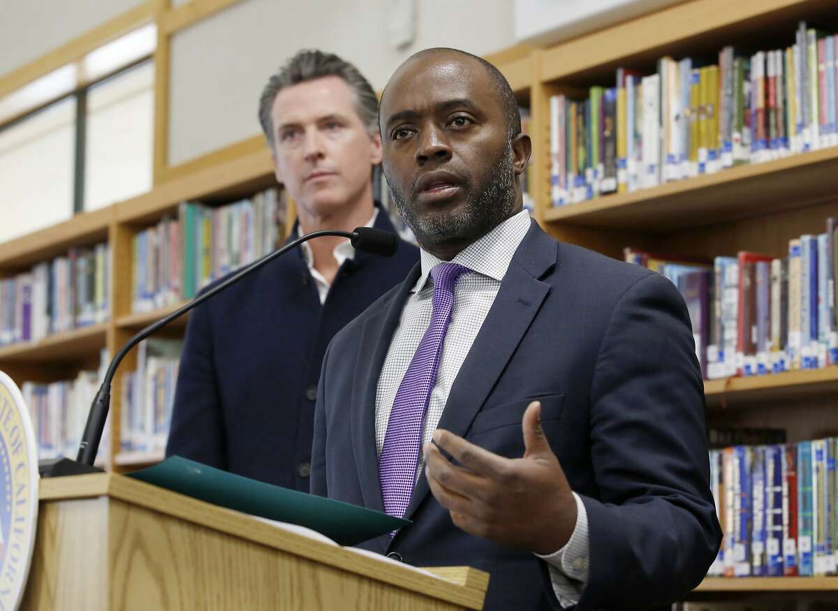 State Superintendent of Public Instruction Tony Thurmond answers a reporter's question during a visit with California Gov. Gavin Newsom, background, to Blue Oak Elementary School in Cameron Park, Calif.