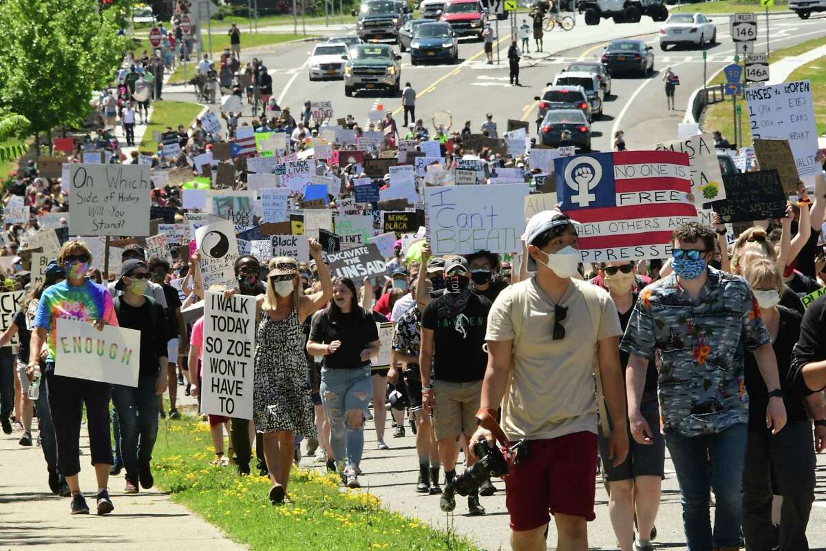 Shenendehowa High School students and others take part in a Black Lives Matter march from Clifton Common to the State Police barracks and back on Monday, June 8, 2020 in Clifton Park, N.Y. (Lori Van Buren/Times Union)