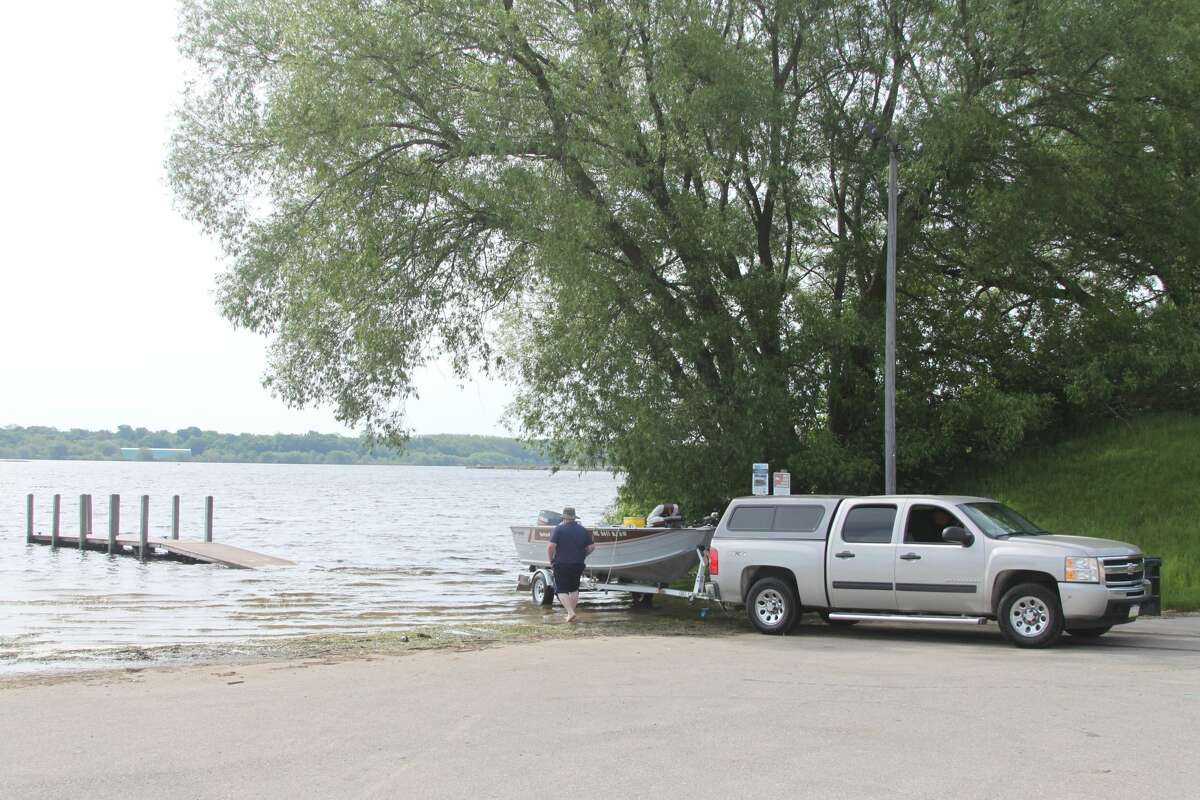 PHOTOS: Manistee Lake docks underwater, rain on the way