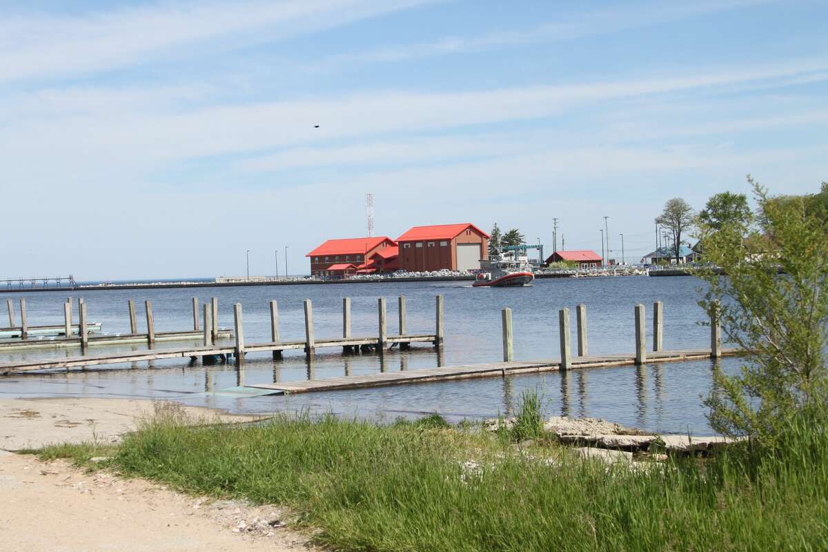 PHOTOS Manistee Lake docks underwater, rain on the way