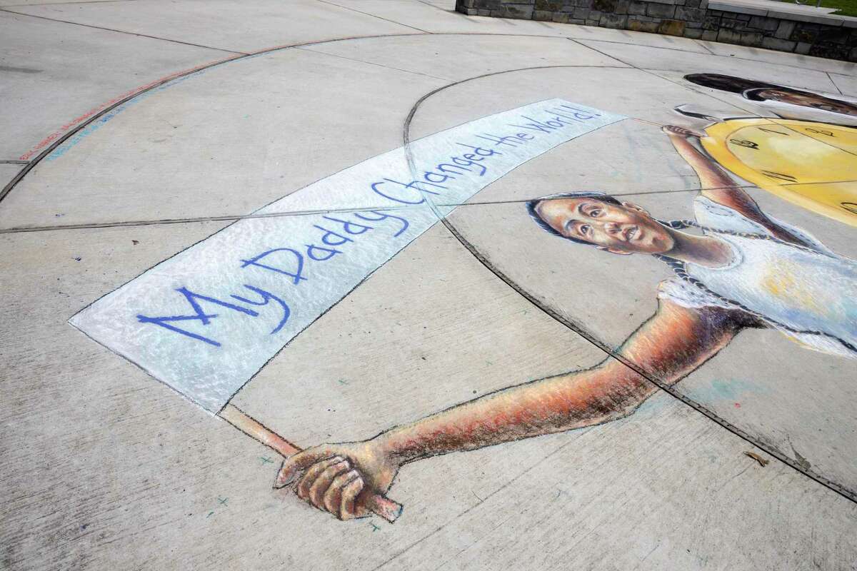 Praying For Progress: Chalk Mural Honors George Floyd’s Memory At North 