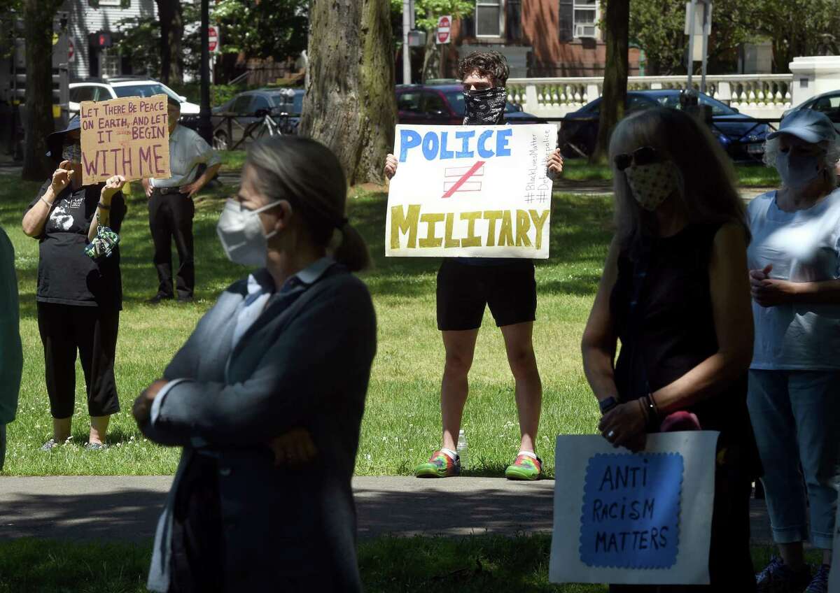 Evan Gambandella, center, of North Haven joined his grandmother, Alicia Clapp, to participate in an elder protest to support black lives, oppose police brutality and support institutional change on the New Haven Green on June 8, 2020.
