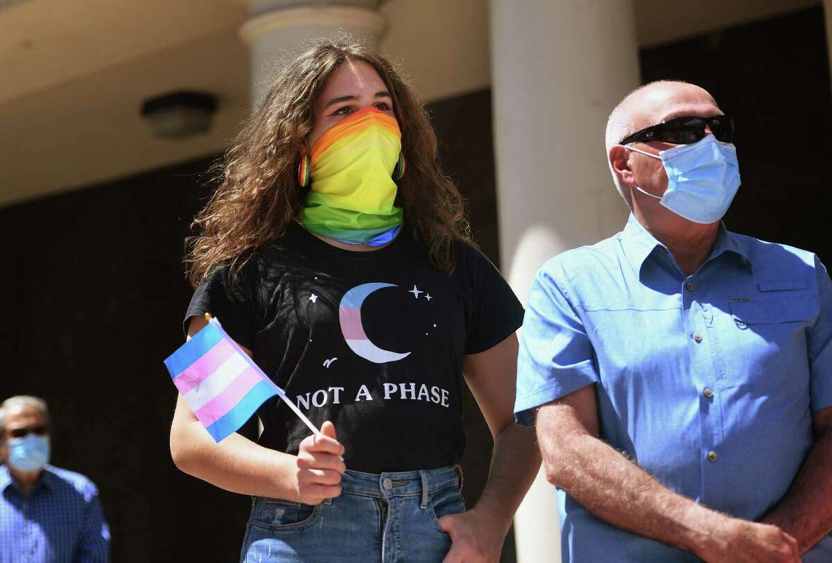 Soledad Perez and her father, Bridgeport Police Chief A.J. Perez, attend the annual gay pride flag raising ceremony at the Margaret Morton Government Center in Bridgeport, Conn. on Monday, June 8, 2020.