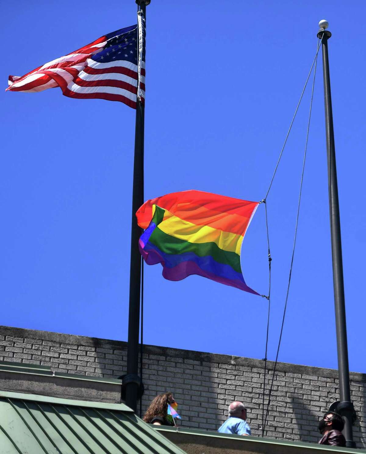 The gay pride flag is raised over the Margaret Morton Government Center in Bridgeport on June 8.
