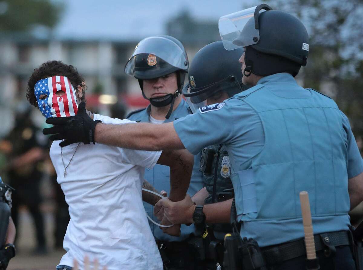 A demonstrator is arressted during a protest against police brutality and the death of George Floyd, on May 31, 2020 in Minneapolis, Minnesota. Protests continue to be held in cities throughout the country over the death of George Floyd, a black man who died while in police custody in Minneapolis on May 25. (Scott Olson/Getty Images/TNS)