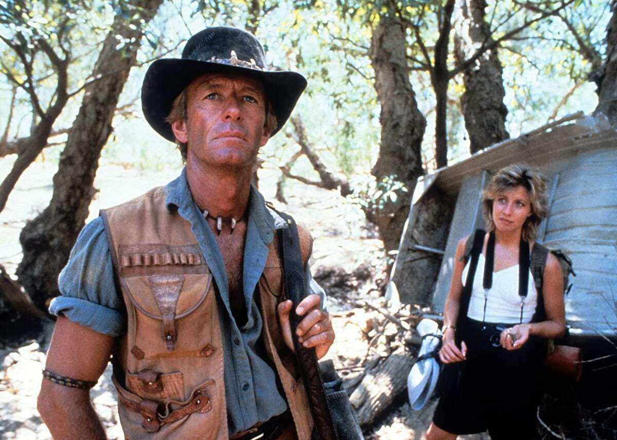 #99. Crocodile Dundee (1986) - Director: Peter Faiman - IMDb user rating: 6.6 - Metascore: 62 - Inflation-adjusted domestic lifetime gross: $432.9 million - Non-adjusted domestic lifetime gross: $174.8 million - Estimated number of tickets sold: 46.2 million - Runtime: 97 min “Crocodile Dundee” tells the story of an Australian wild man who comes to New York City to navigate a whole new type of “wild.” The movie was a smash success Down Under, at the time shattering all box office records. The characters are lovable, and the story is comedic, which makes up for what Nina Darnton described in The New York Times as the film's "illogical plot and set-up situations." This slideshow was first published on Stacker