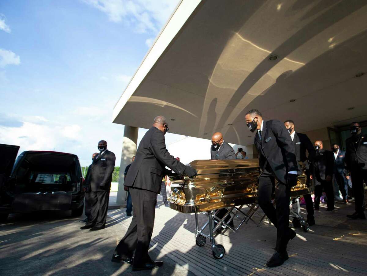George Floyd's casket leaves the building after a public memorial for him Monday, June 8, 2020, at The Fountain of Praise Church in Houston.