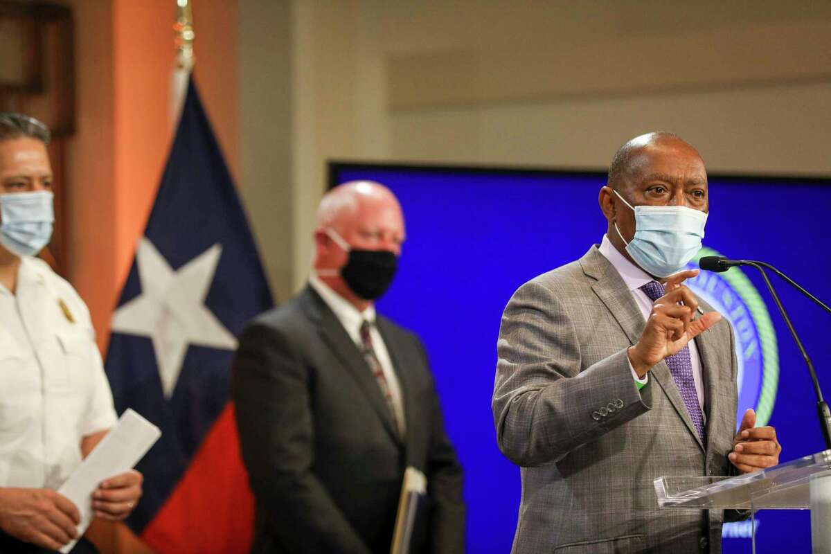 Houston Mayor Sylvester Turner, right, said the city will launch a crackdown on businesses flouting state and local coronavirus restrictions.